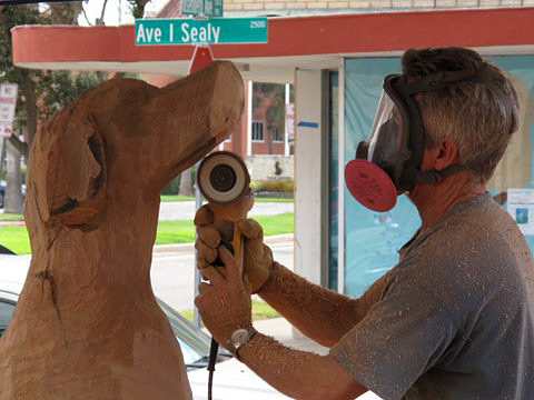 James Phillips carves a tree in Galveston.