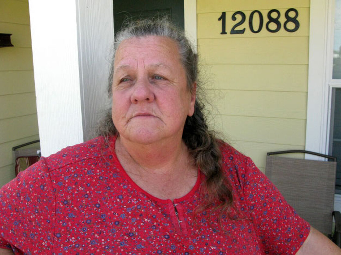 Belinda Wilkerson on the front porch of her FEMA cottage in Safe Harbor Estates, a new subdivision.