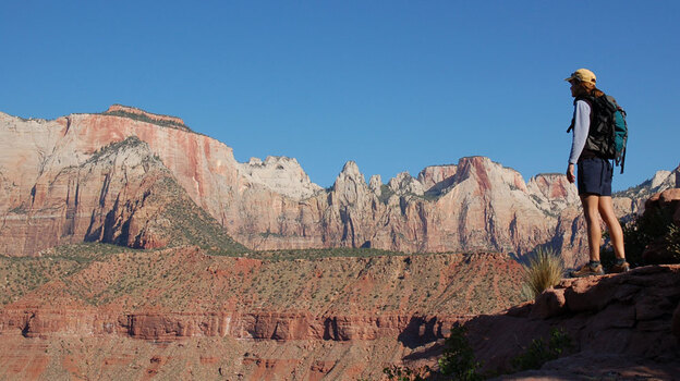 A hiker in Zion National Park (wide)