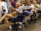 Howard Cross of Grass Valley, Calif., reads the paper in the desk chair he plans to buy. Howard Cross of Grass Valley, Calif., reads the paper in the desk chair he plans to buy.