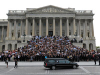 Mourners stand on the steps of the U.S. Capitol awaiting the arrival of the hearse carrying the remains of Sen. Edward Kennedy in Washington, D.C.