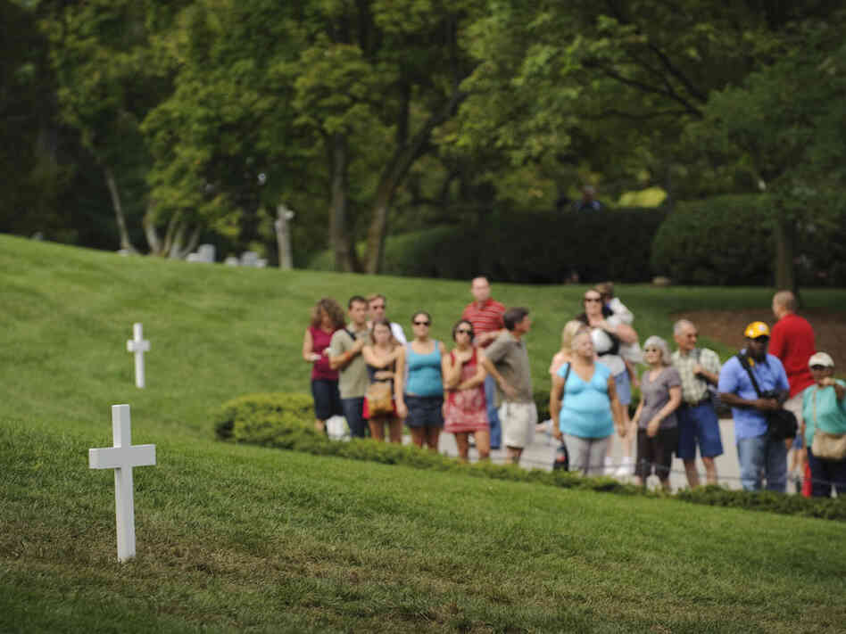 Visitors line up to pay their respects at the gravesite of Sen. Edward Kennedy