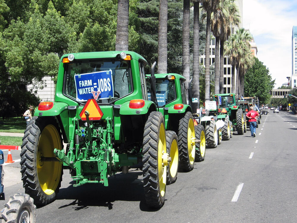 As the Sacramento rally was starting, a line of John Deere tractors paraded through downtown