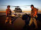 Pararescue Jumpers transport a policeman.
