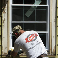A worker installs a new window.