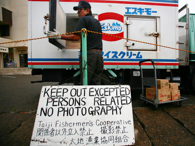 A signboard posted by Taiji Fishery Cooperative at a port in Taiji. Junji Kurokawa/AP