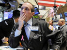 Specialist James Denaro works at his post on the floor of the New York Stock Exchange. Specialist James Denaro works at his post on the floor of the New York Stock Exchange.