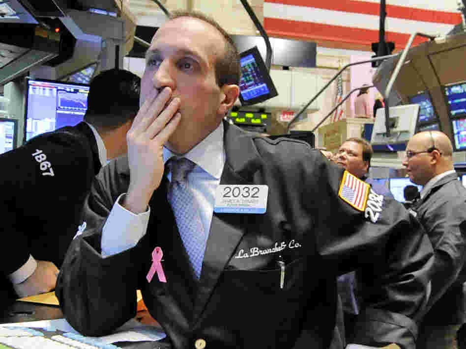 Specialist James Denaro works at his post on the floor of the New York Stock Exchange. Specialist James Denaro works at his post on the floor of the New York Stock Exchange.