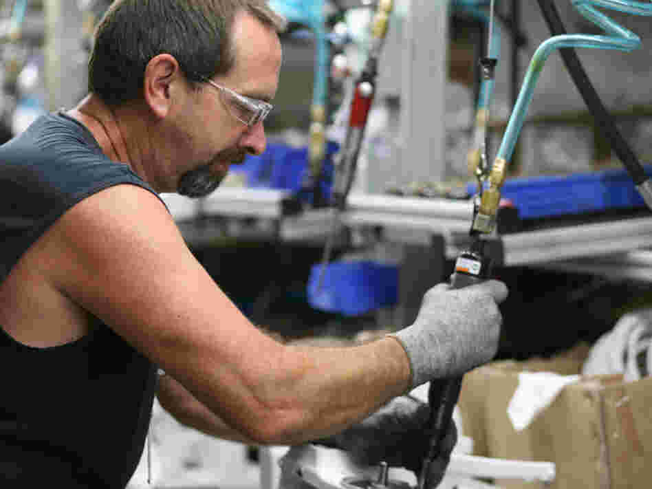 Dwight Bevins assembling part of the pedestal on the KitchenAid Classic.