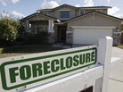 A foreclosure sign sits outside a home for sale in Phoenix, Feb. 17, 2009. A foreclosure sign sits outside a home for sale in Phoenix, Feb. 17, 2009.