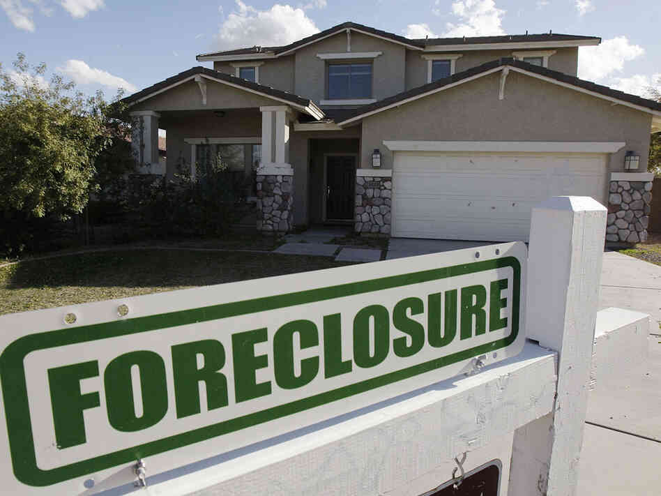 A foreclosure sign sits outside a home for sale in Phoenix, Feb. 17, 2009. A foreclosure sign sits outside a home for sale in Phoenix, Feb. 17, 2009.