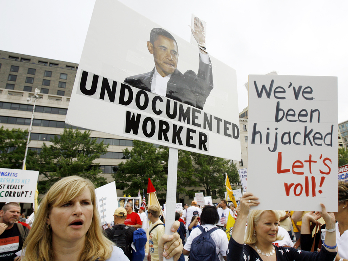 Protesters rally at Freedom Plaza in Washington Saturday. Jose Luis Magana/AP