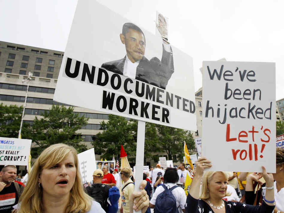 Protesters rally at Freedom Plaza in Washington Saturday. Jose Luis Magana/AP