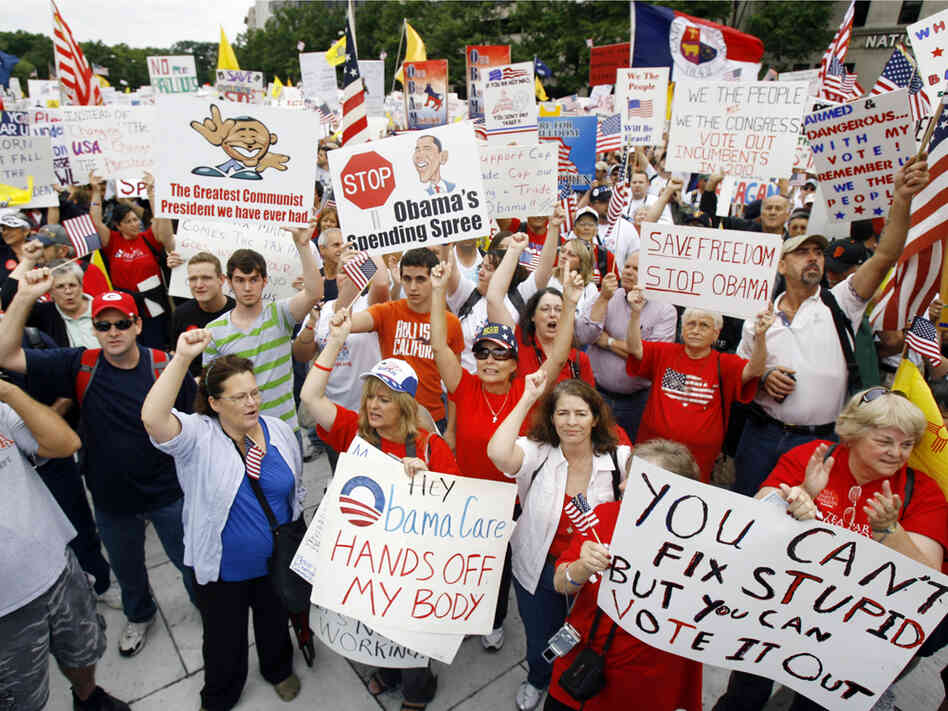 Protesters rally at Freedom Plaza in Washington Saturday. Jose Luis Magana/AP