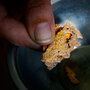 A gold seller in Puerto Maldonado, Peru, offers a piece of pure gold for sale. A gold seller in Puerto Maldonado, Peru, offers a piece of pure gold for sale.