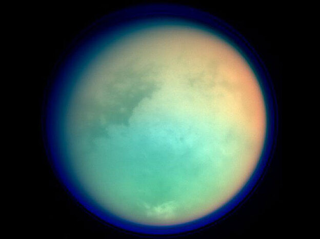Titan has a very large atmosphere that extends hundreds of kilometers above it's surface.