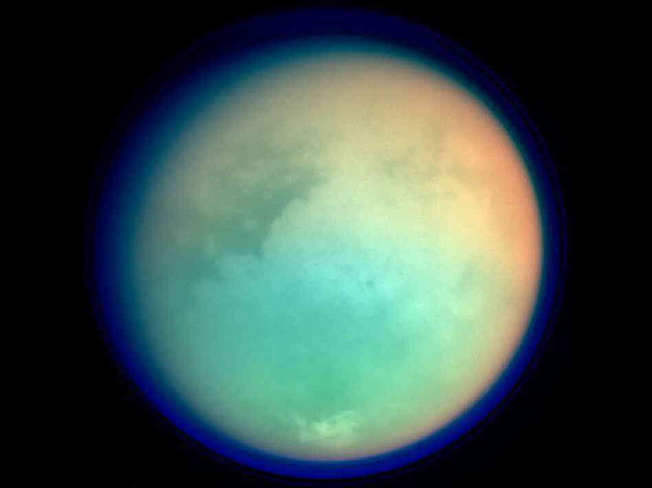Titan has a very large atmosphere that extends hundreds of kilometers above it's surface.