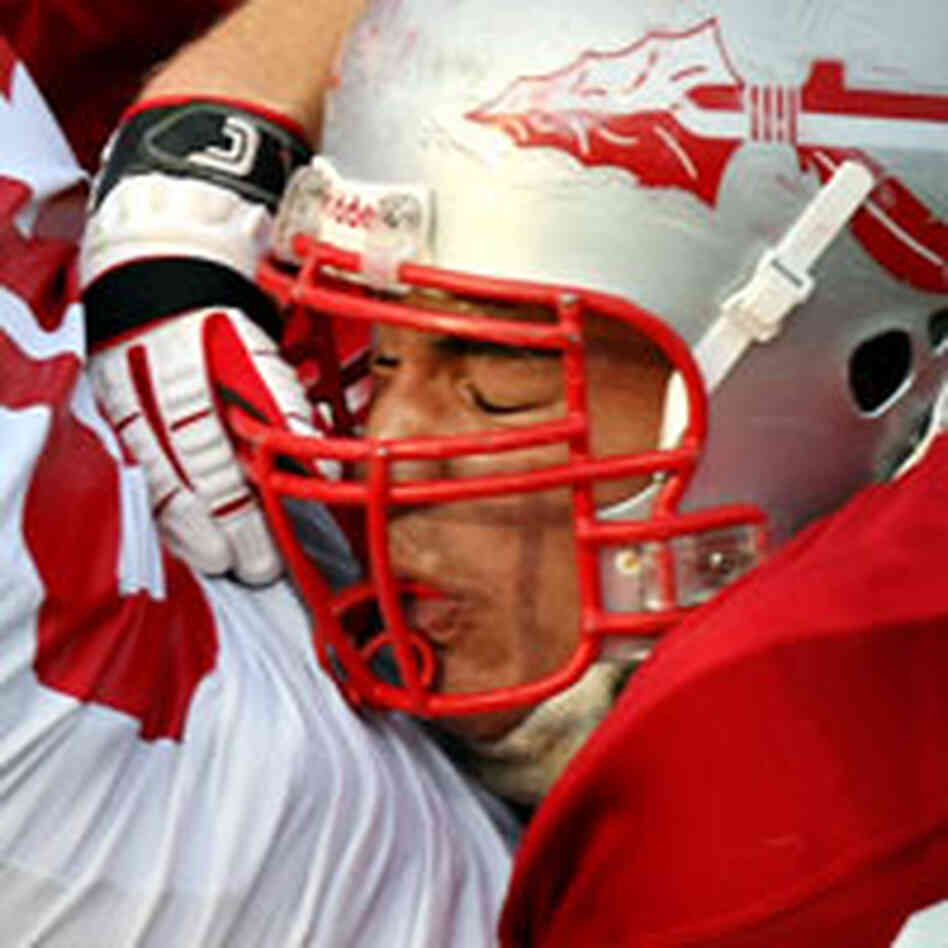 Bountiful's Helam Heimuli, right, brings down Spanish Fork running back Dallas Smith from behind. Bountiful's Helam Heimuli, right, brings down Spanish Fork running back Dallas Smith from behind.