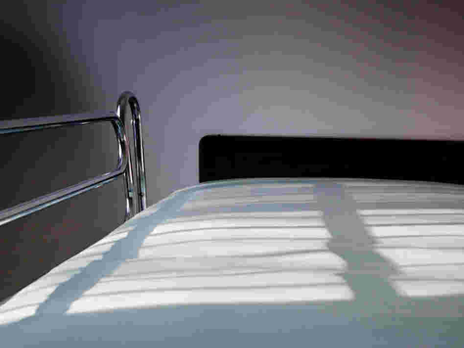 An empty hospital bed.