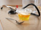 Jello and a spoon on a hospital tray. Jello and a spoon on a hospital tray.