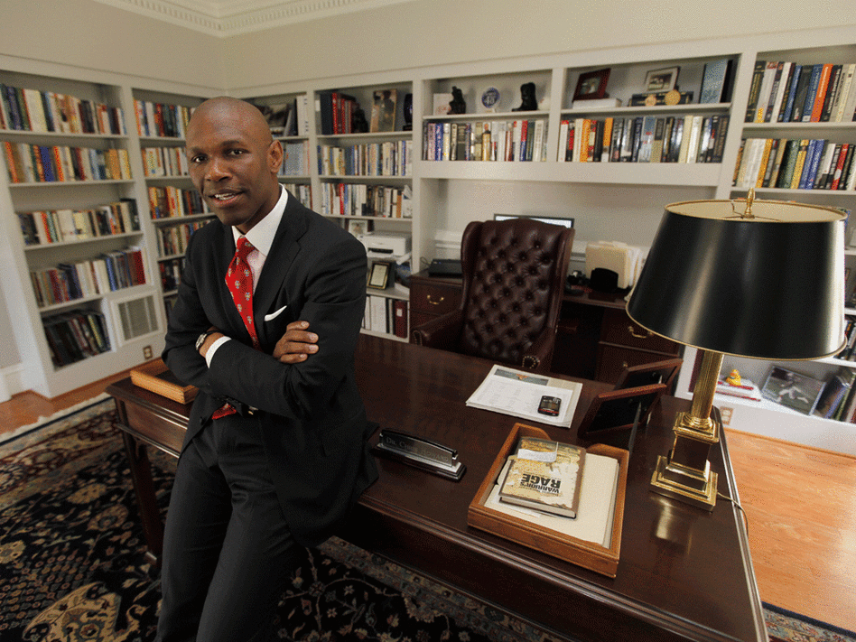 Chris Howard poses in his office. Steve Helber/AP