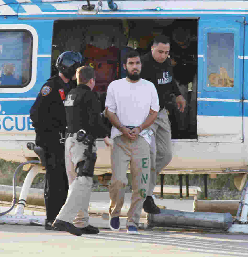 Najibullah Zazi is escorted off a New York Police Department helicopter by U.S marshals