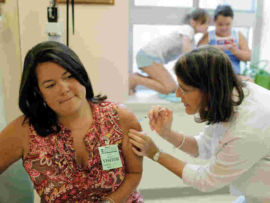 Julie Halverson receives a trial swine flu vaccine.