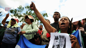 Supporters of deposed Honduran President Manuel Zelaya protest Saturday in the El Pedregal neighborhood of Tegucigalpa, the Honduran capital.