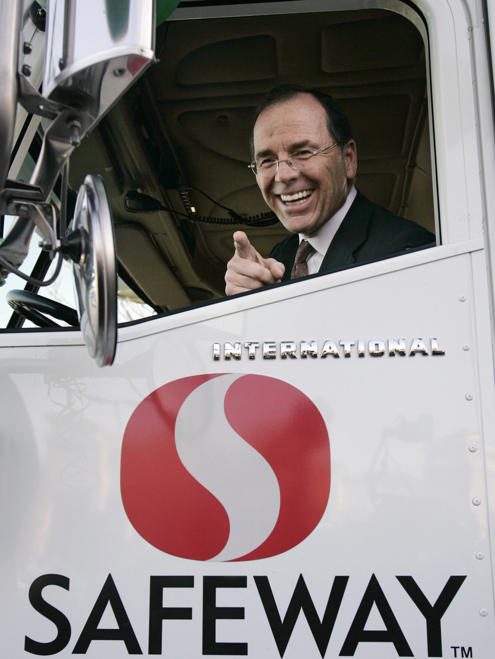 Safeway, Inc., executive Steve Burd sits in a Safeway delivery truck.