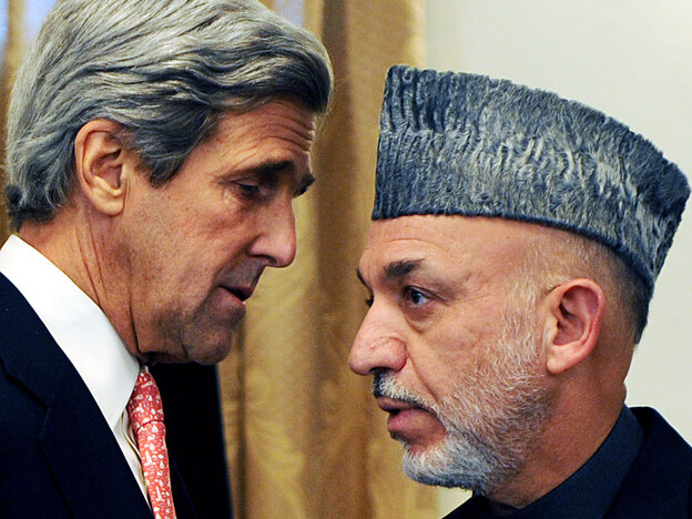 U.S. Sen. John Kerry speaks with Afghan President Karzai