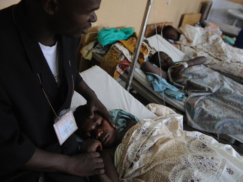 WIDE: Minister with rape victim in Goma, Democratic Republic of Congo