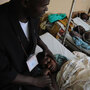 Minister with rape victim in Goma, Democratic Republic of Congo