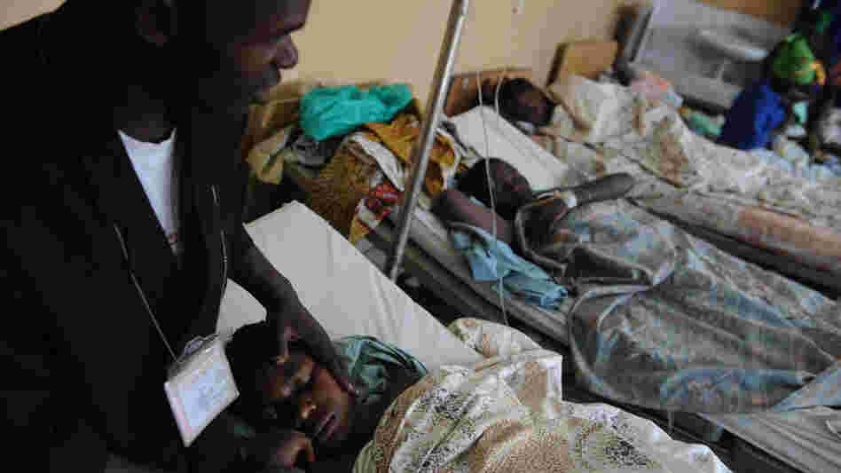 WIDE: Minister with rape victim in Goma, Democratic Republic of Congo