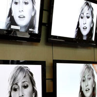 A customer looking at flat-panel televisions