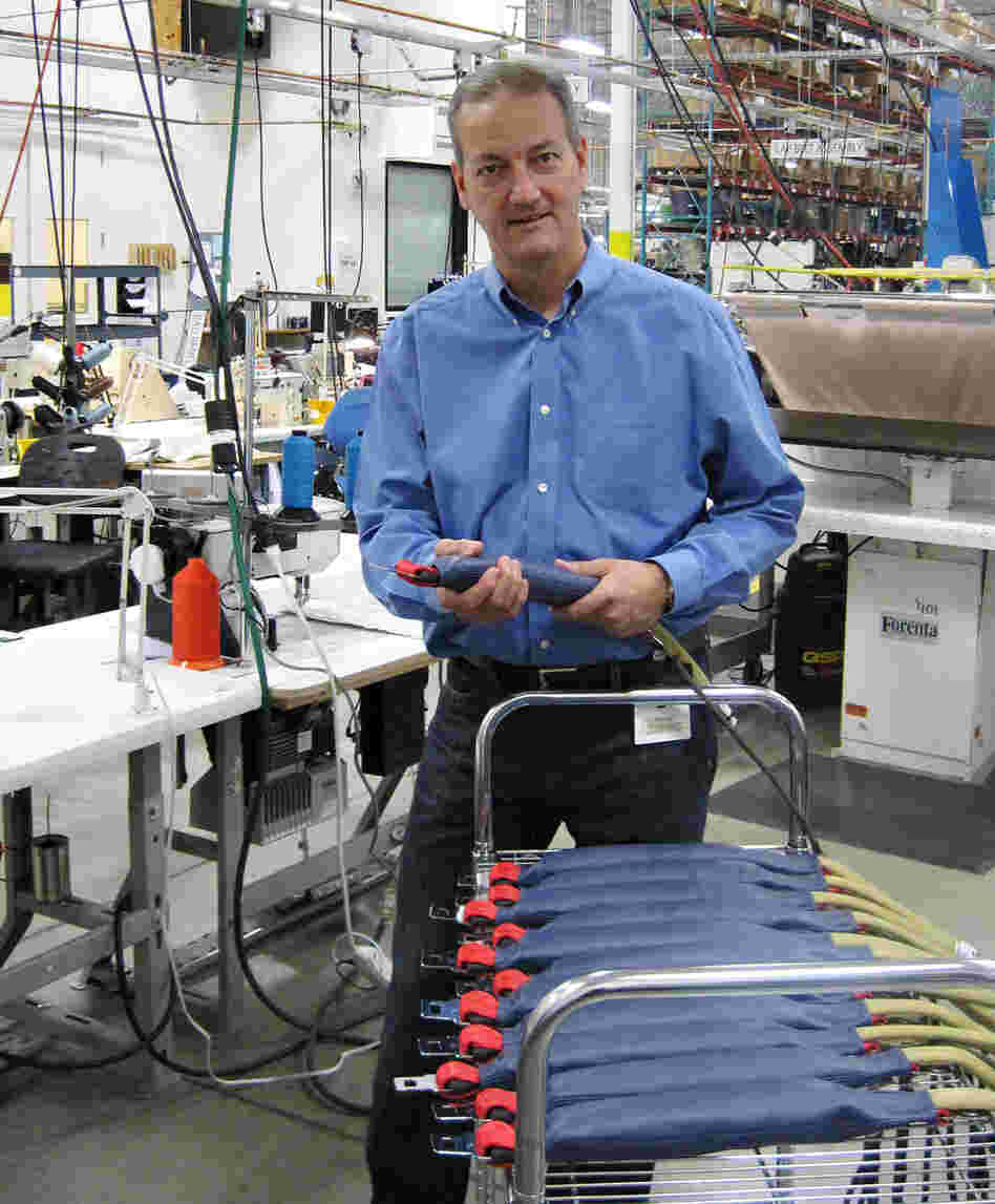 CUSTOM: AmSafe's Bill Hagan displays the seatbelts with air bags
