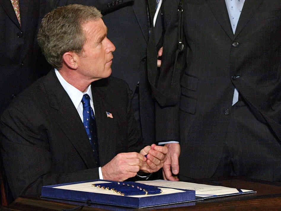 President Bush signs the Patriot Act into law.