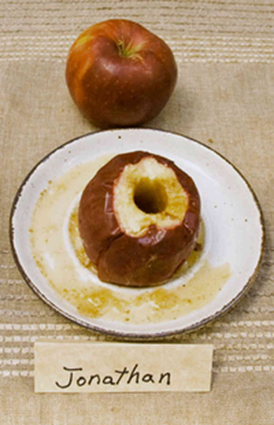 Two Jonathan apples -- one baked and one fresh Two Jonathan apples -- one baked and one fresh