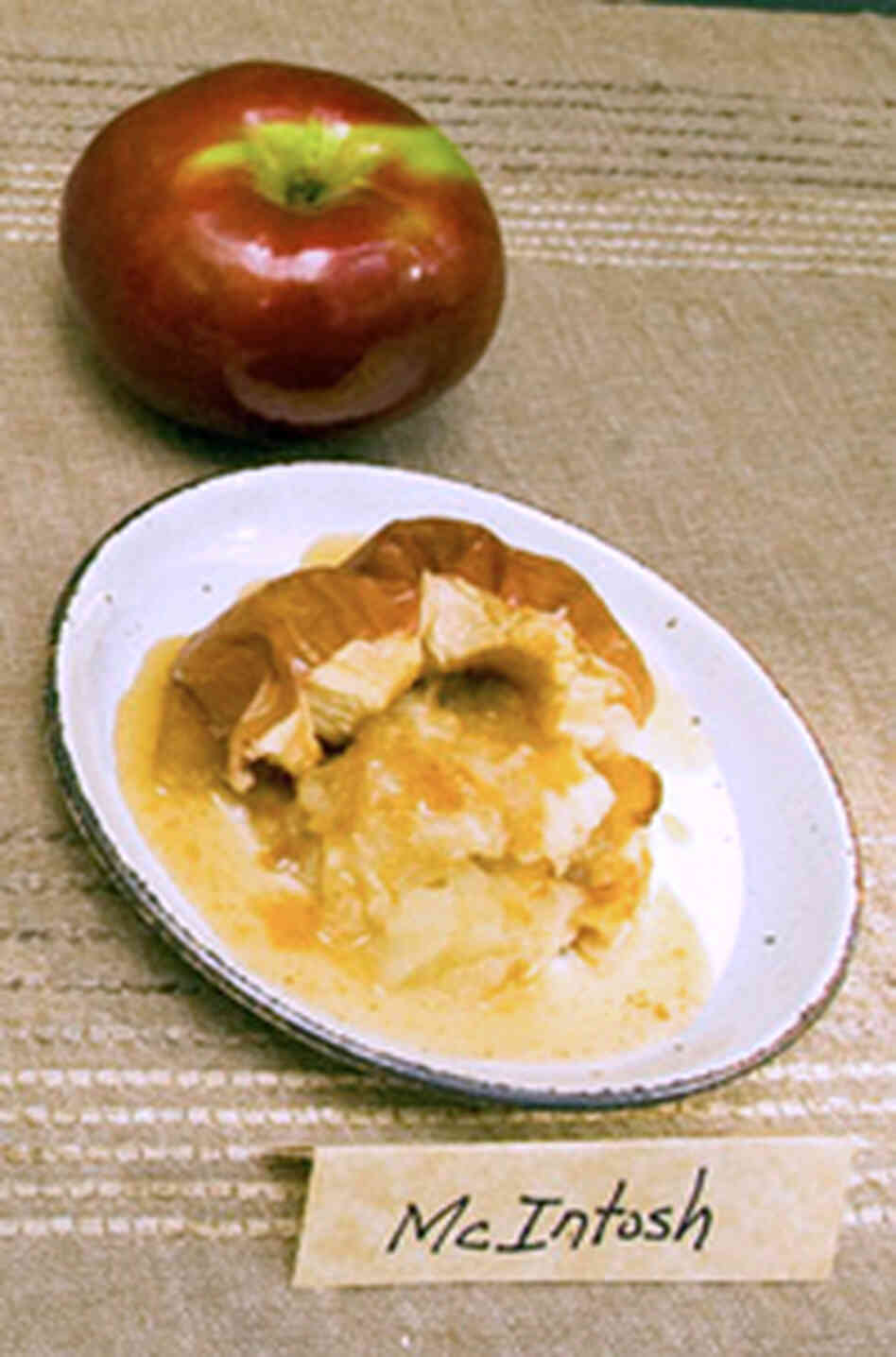 Two McIntosh apples -- one baked and one fresh Two McIntosh apples -- one baked and one fresh