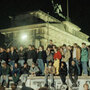 Hundreds of Berliners gather by the Brandenburg Gate to watch the dismantling of the Berlin Wall.