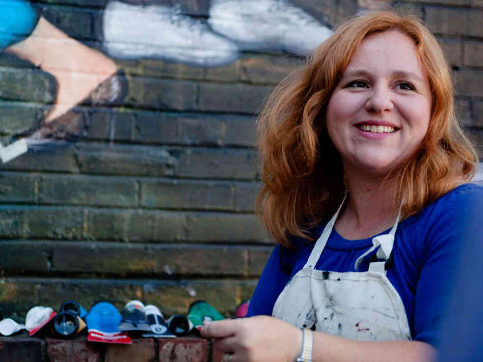 Regina Holliday prepares her supplies for a day of painting.