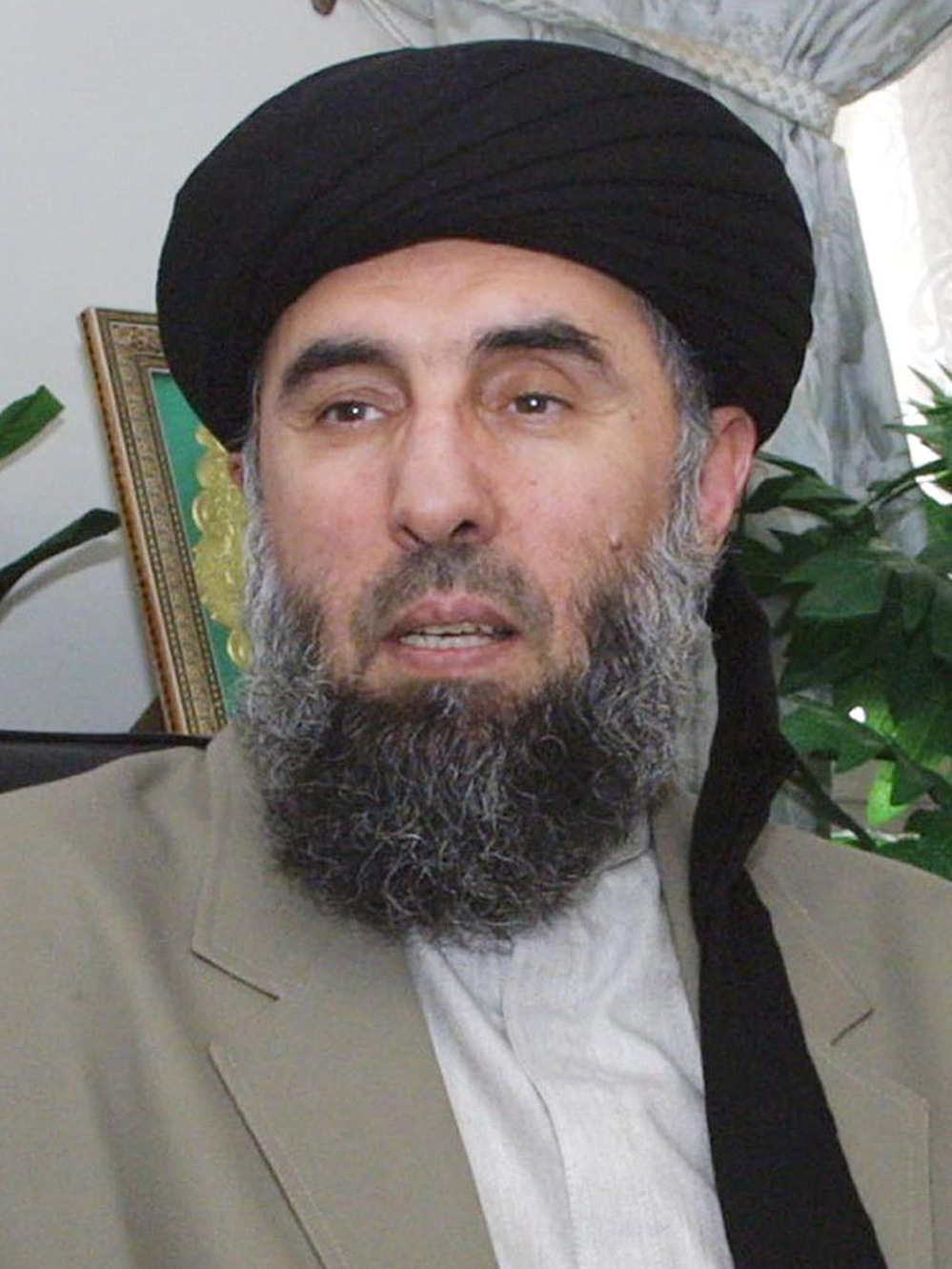 Gulbuddin Hekmatyar gives an interview to AFP in Tehran in October 2001.