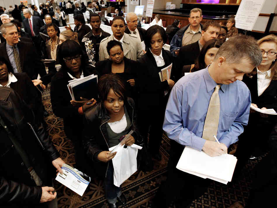 Job-seekers attend a job fair in Livonia, Mich., on Wednesday.