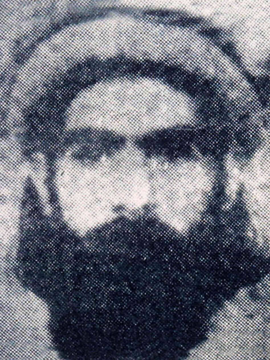 The rarely photographed Taliban leader Mullah Omar is reportedly seen in this undated photo.