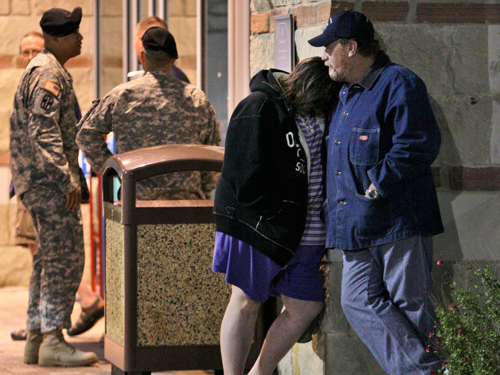 Jamie Casteel and her husband, Scotty, await news of their son-in-law outside the emergency room