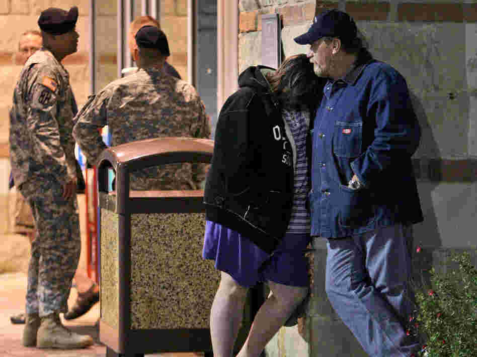 Jamie Casteel and her husband, Scotty, await news of their son-in-law outside the emergency room
