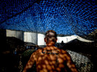 A Marine with Fox Company relaxes at a base in Helmand province. A Marine with Fox Company relaxes at a base in Helmand province.