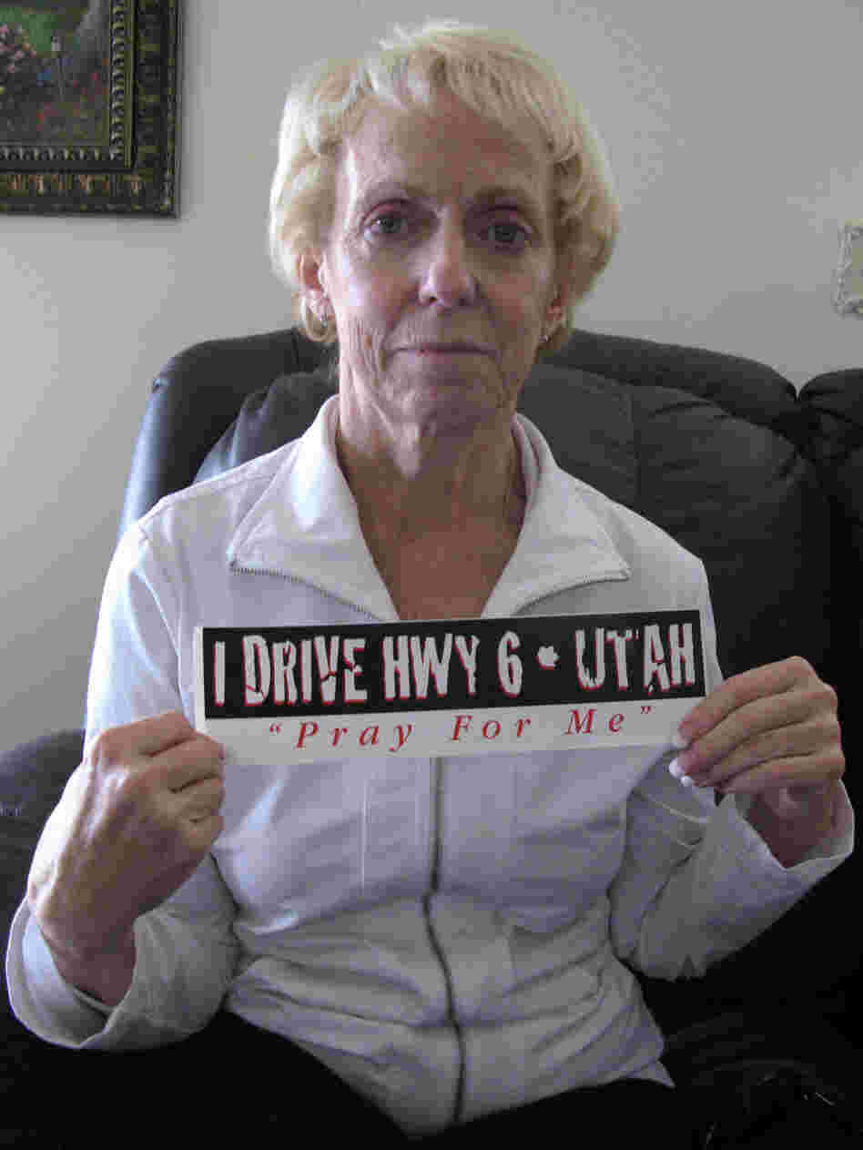 Kathy Justice with a bumper sticker that says I Drive Hwy 6 - Utah Pray For Me