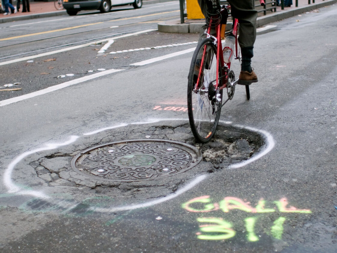 Frank Chan at San Francisco's 1,000th pothole