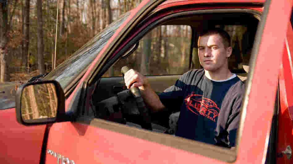 Basil Rynestead, 17, sits in the driver's seat of his Toyota pickup truck.