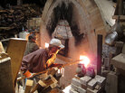 Volunteers Nancy Parent and Dan Corwin-Renner stoke the kiln. Volunteers Nancy Parent and Dan Corwin-Renner stoke the kiln.